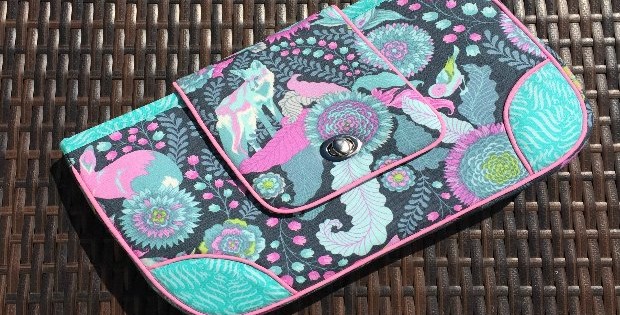 This clutch is the absolute perfect size. I've made several for myself and friends - free sewing pattern and always great results. One of my favorites.