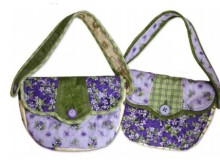 Ideal purse sewing pattern for quilters, with a dresden plate style flap.
