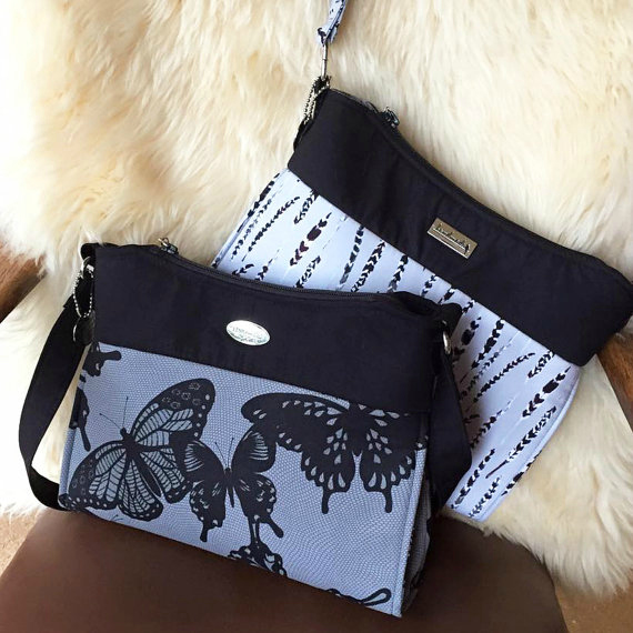 The Gabby Bag is a shoulder bag/purse which features exterior & interior zipper pockets, as well as an interior double slip pocket. It has a single shoulder strap that is approximately 34” long, but you can lengthen or shorten it to suit your own style.