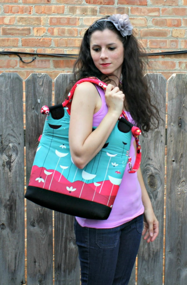 Lapin Noir Tote Bag sewing pattern. The Lapin Noir converts from a handled tote to a large carry-all, with a cell phone pocket and enough pockets inside and out to keep your most important items within easy reach. The handles are corded and covered in fabric, with pretty knots at each end, and the long strap is attached to the bag with fun swivel clips. If you’re looking for a bag to showcase your favorite fabric print, this is it!