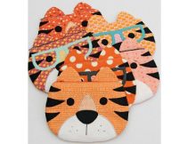 Children will love owning one of these fun zipper pouches that have the face of a tiger. They can store all kinds of school supplies in them or some of their smaller favorite toys. These zipper pouches are fully lined and can be completed by a confident beginner sewer who has the knowledge of some basic sewing skills required. It's the perfect pattern for a beginner who has never sewn a zipper before.