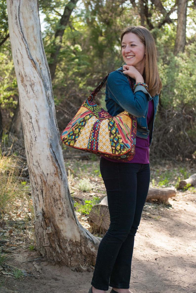 Great purse or handbag sewing pattern. The Sunburst Sling bag is great for using up smaller pieces of fabric that are too small to make a whole bag.