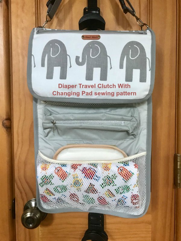 Diaper Travel Clutch With Changing Pad sewing pattern. This has got to be one of the best Diaper Travel Clutch bags that there is. It's a handy hanging organizer with a magnetic closure, detachable changing pad, zippered pocket on the front panel, diaper mesh pockets and two zippered pockets inside.