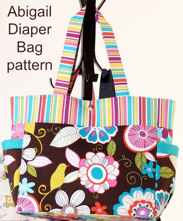 This is a great looking Diaper Bag. It's the Abigail Diaper Bag and like the designer we feel that it really is a cut above the usual mass produced shop-bought ones. It's a vibrant, modern and trendy bag where you can really show off your current favorite fabrics.