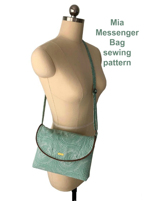 This is the Mia Messenger Bag which is a very pretty small messenger bag. It has lots of pockets, a magnetic snap closure on the front flap and is fully lined with a solid construction.