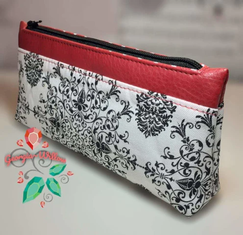 Cute zipper pouch made from free sewing pattern standing upright on counter